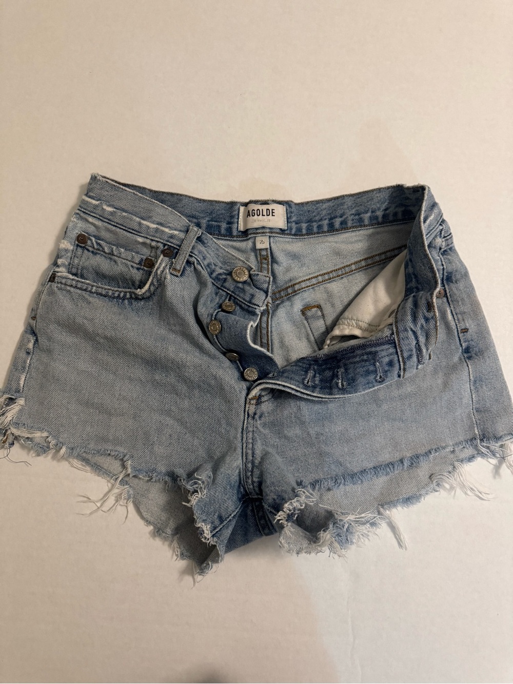Agolde Faded Light Blue Distressed Cutoff Jean Shorts